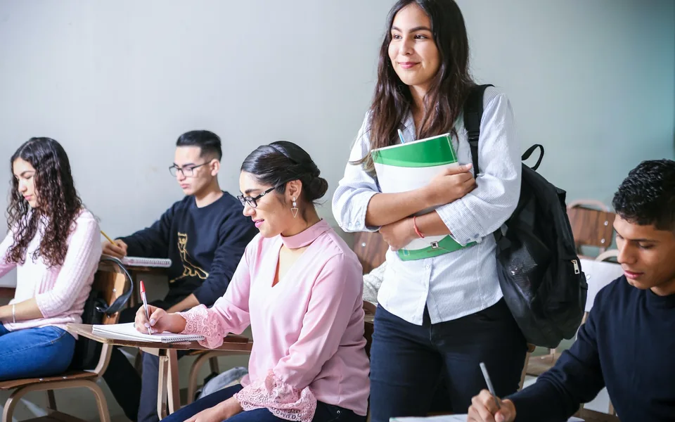 Students studying together in a classroom.