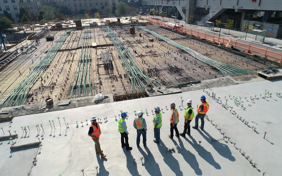 Construction crew reviewing an active building site.