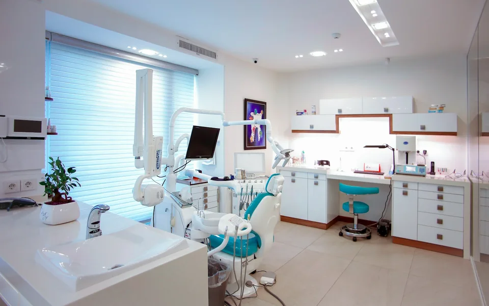 Treatment chair and equipment inside a dental clinic.