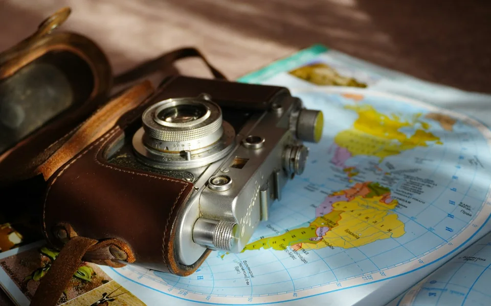 Travel camera arranged on a world map.