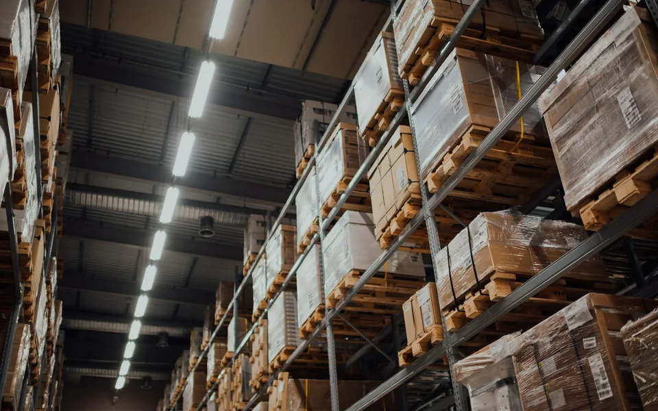 Boxed inventory on warehouse storage racks.